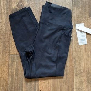 RBX Active ankle length high waisted leggings. Medium. NWT. Black with camo.